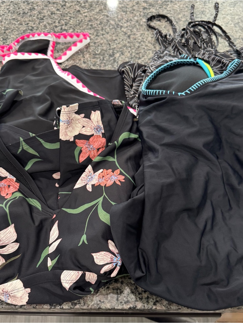 One full piece and 3 takini tops all fit a 3xl and new or gently used